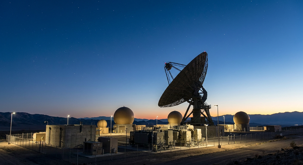 Military strategic satellite communications dish antenna and hardened radome terminal station at twilight