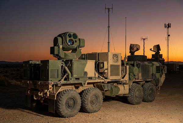 Modern directed-energy counter-drone weapon system deployed on a tactical platform at an open military test range